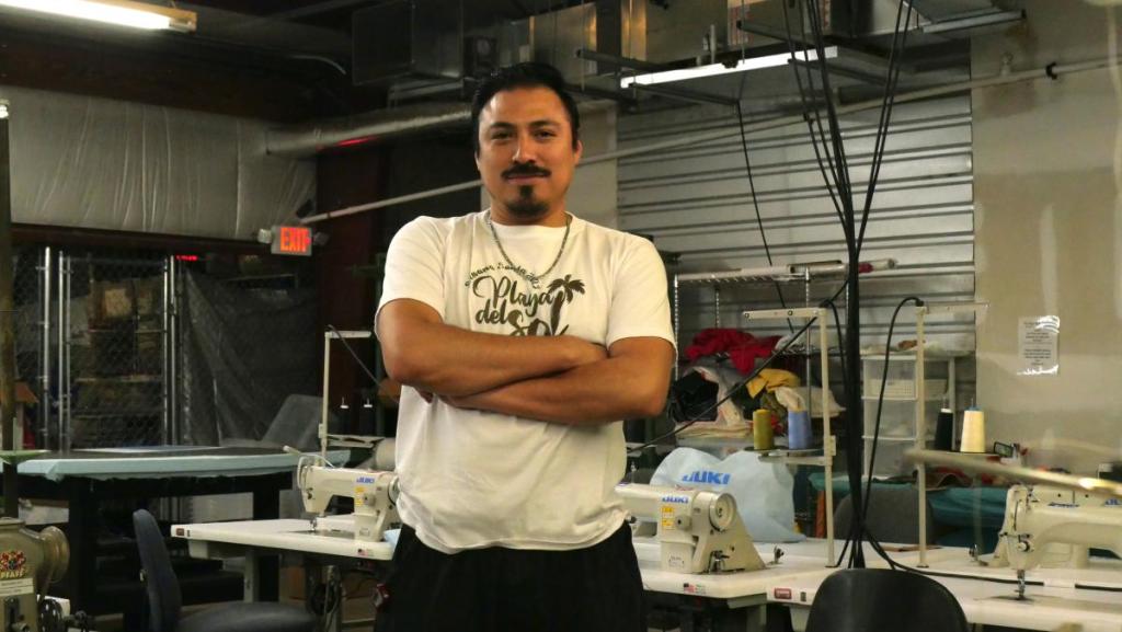 Alan Ramírez coordinates the Industrial Sewing Program at the Centro Cultural y Económico El Porvenir in the city of Asheville. The program is part of the Universidad Popular, where English and computer classes are also offered. All courses are free, in Spanish and geared toward the local Latino community. Photo: Patricia Serrano / ELNC
